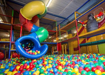 tube slide that opens into a ball pit