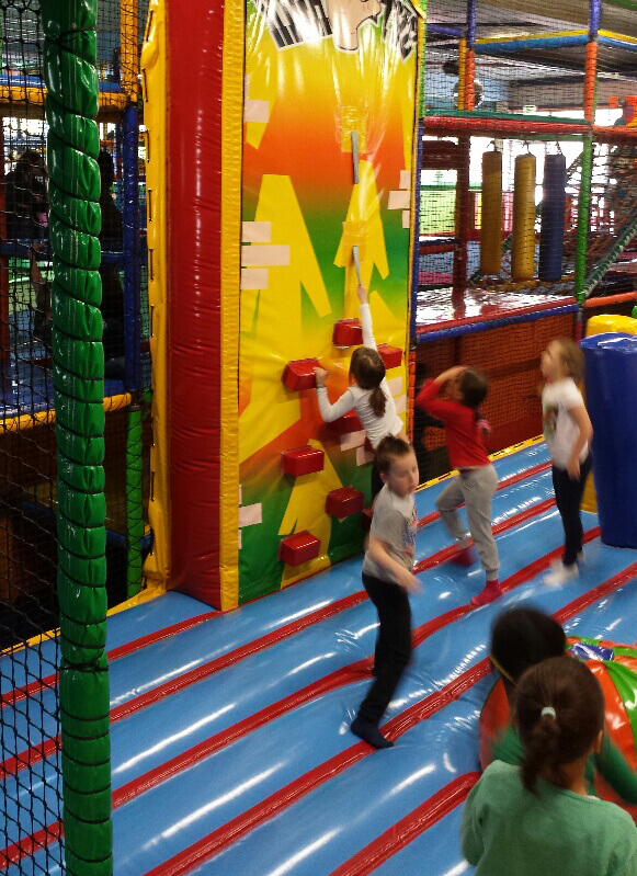 children playing on climbing wall cushion