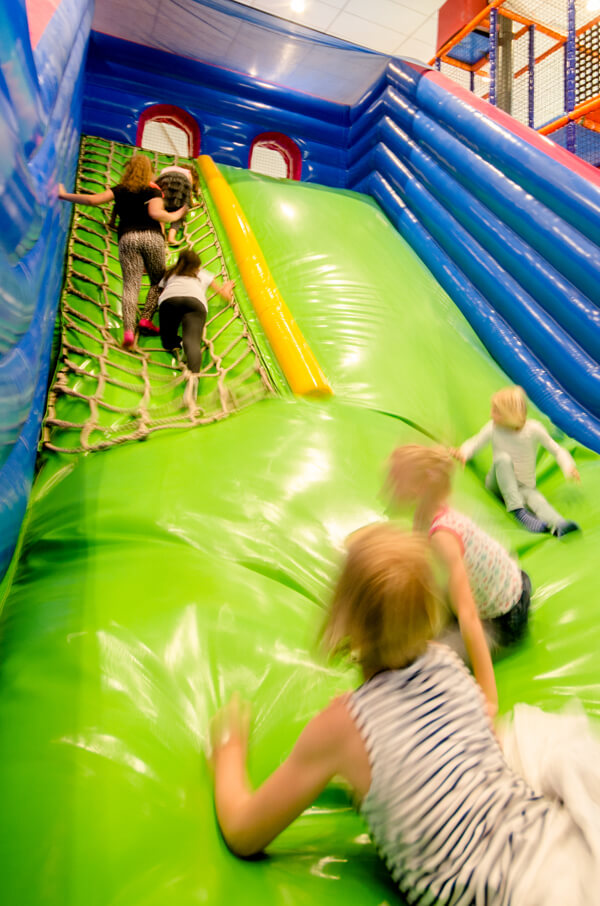 group of children on cushion slide